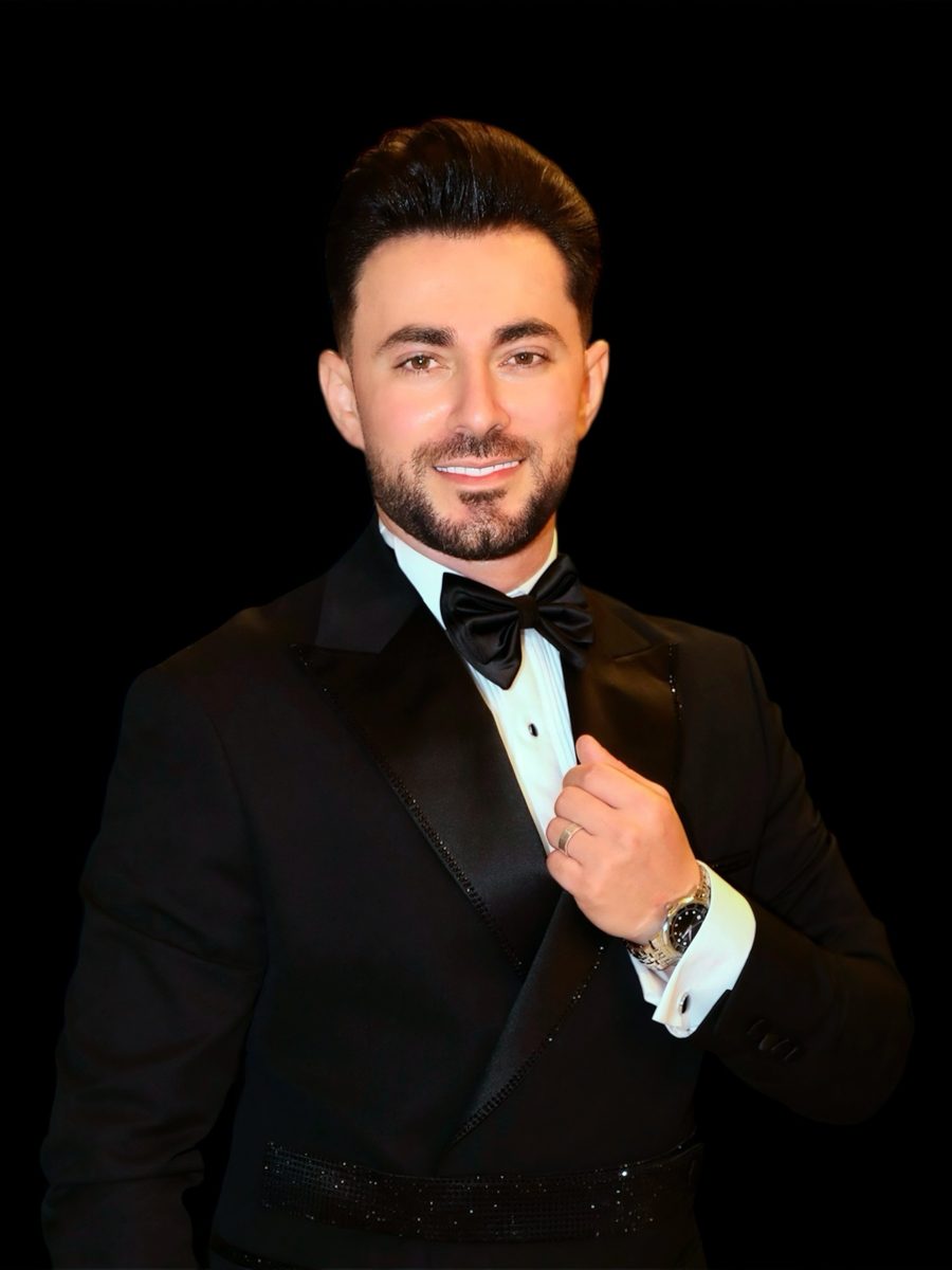 Bil Baz in a black tuxedo and bow tie